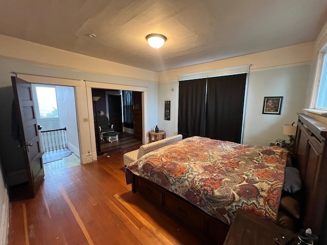 bedroom with hardwood / wood-style flooring