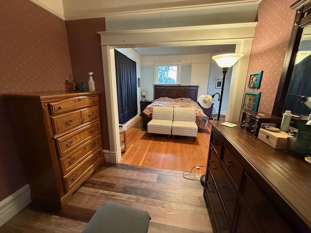 bedroom with hardwood / wood-style flooring