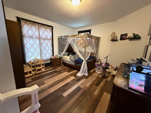 bedroom featuring hardwood / wood-style flooring