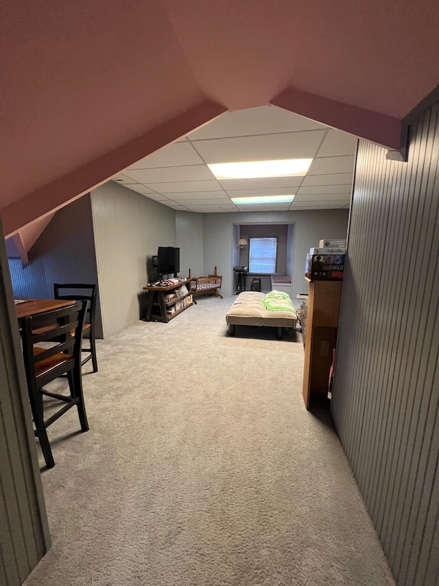 carpeted bedroom with a drop ceiling