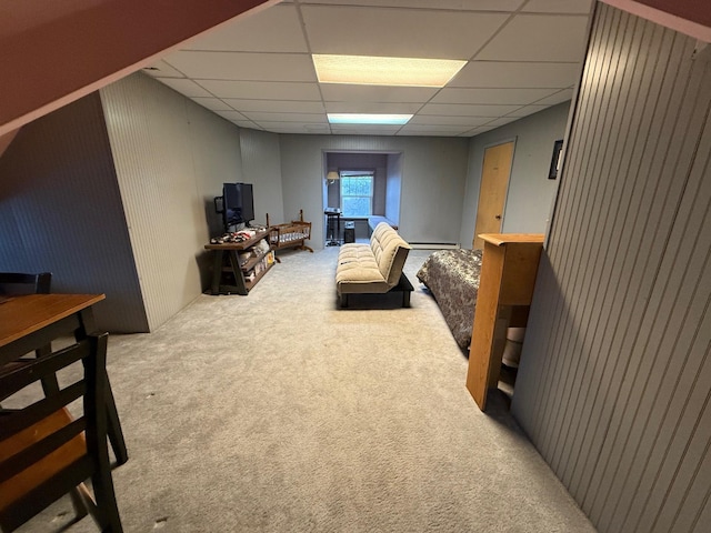 bedroom with carpet flooring and a paneled ceiling