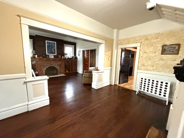 interior space featuring a fireplace and dark hardwood / wood-style floors