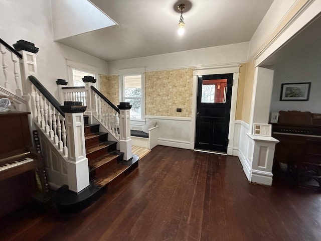 foyer entrance with dark hardwood / wood-style flooring