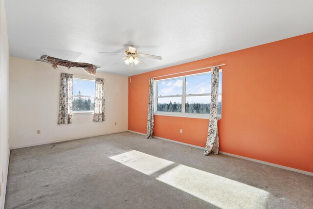 empty room with light carpet and ceiling fan