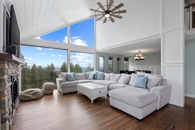 living room featuring wood ceiling, ceiling fan with notable chandelier, dark wood-type flooring, and high vaulted ceiling