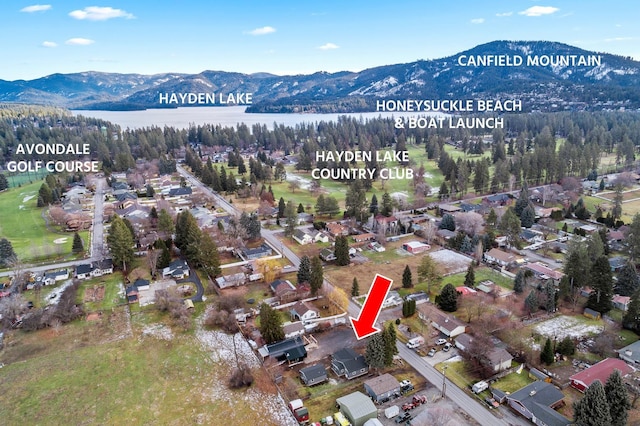 birds eye view of property featuring a water and mountain view