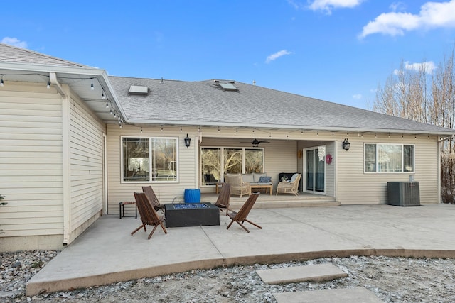 rear view of house featuring an outdoor hangout area, central AC unit, and a patio area