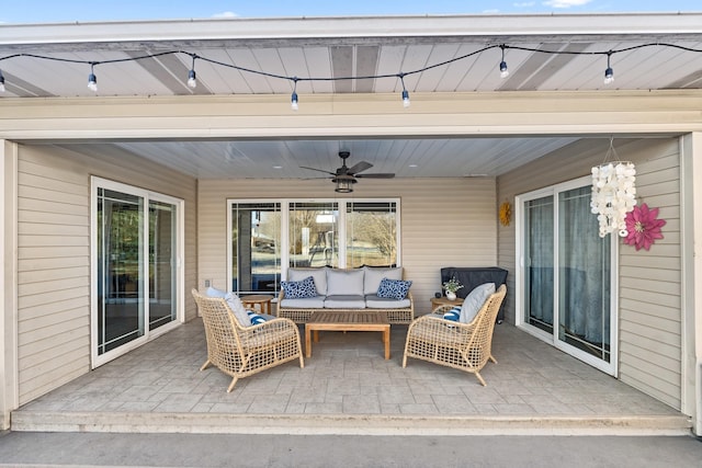 view of patio with an outdoor living space and ceiling fan