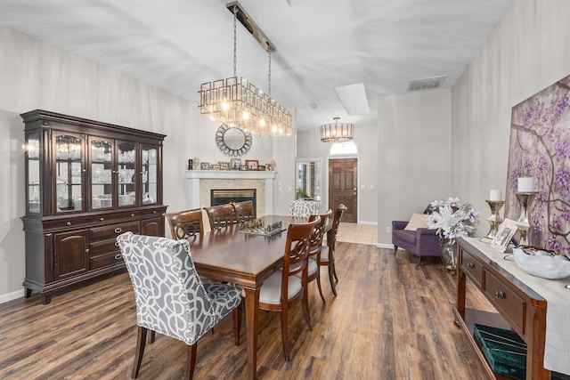 dining space featuring dark wood-type flooring