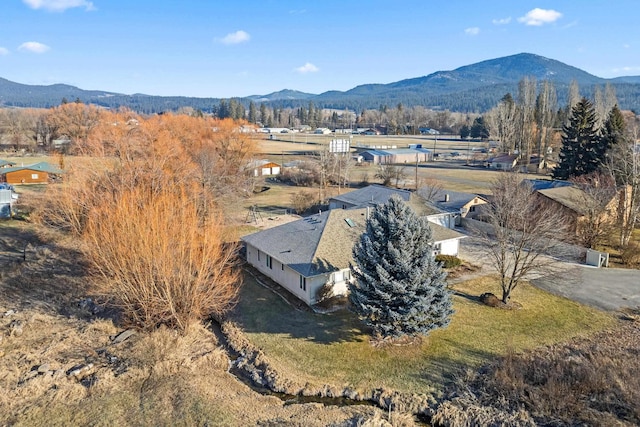 drone / aerial view featuring a mountain view