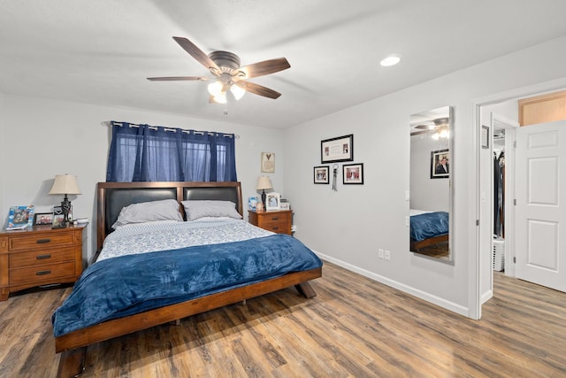 bedroom featuring ceiling fan and hardwood / wood-style floors