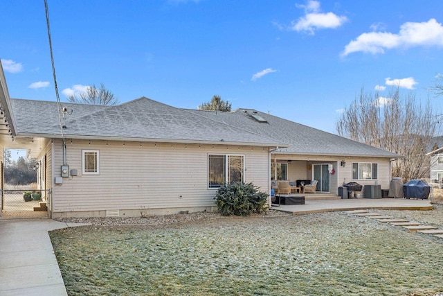 back of property featuring a yard and a patio area