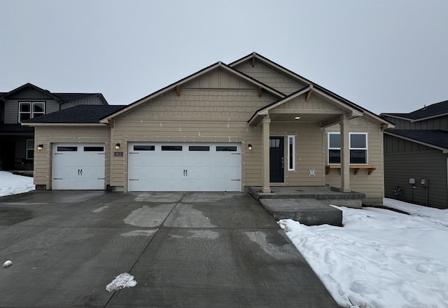 view of front of property featuring a garage, driveway, and board and batten siding