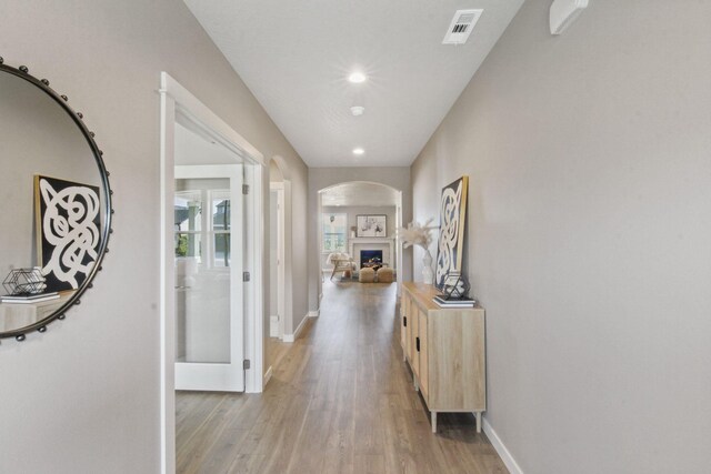 hall with light wood-type flooring