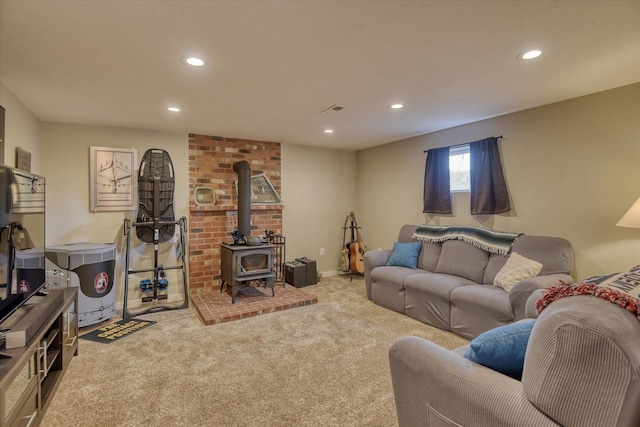 living room with light colored carpet and a wood stove