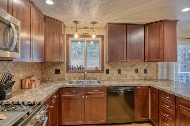 kitchen featuring black dishwasher, sink, decorative backsplash, hanging light fixtures, and light stone counters