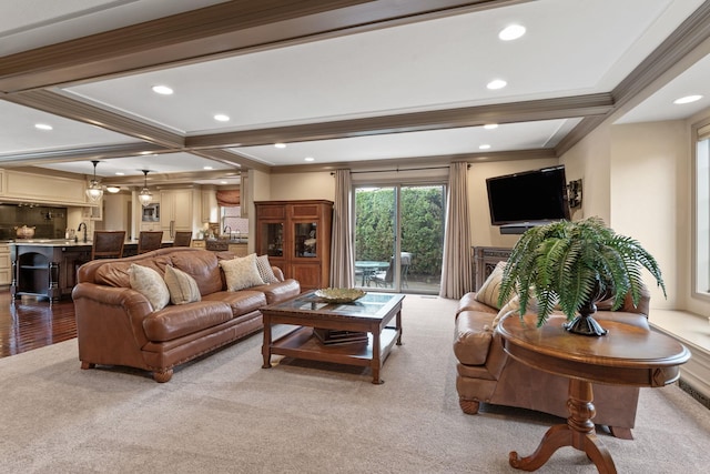 living room featuring coffered ceiling, sink, crown molding, and beamed ceiling