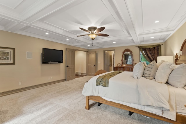 carpeted bedroom featuring beamed ceiling, ornamental molding, coffered ceiling, a spacious closet, and ceiling fan