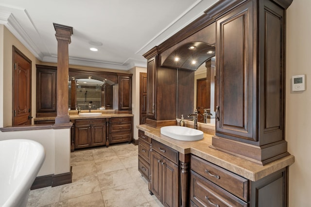 bathroom with ornate columns, vanity, ornamental molding, and plus walk in shower