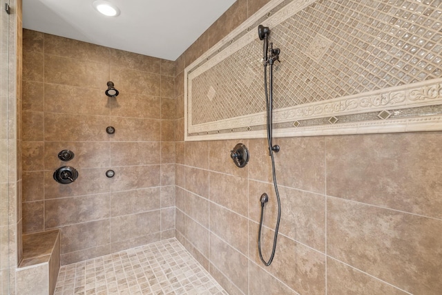 bathroom featuring tiled shower