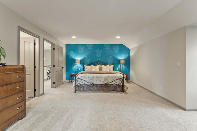 carpeted bedroom with lofted ceiling