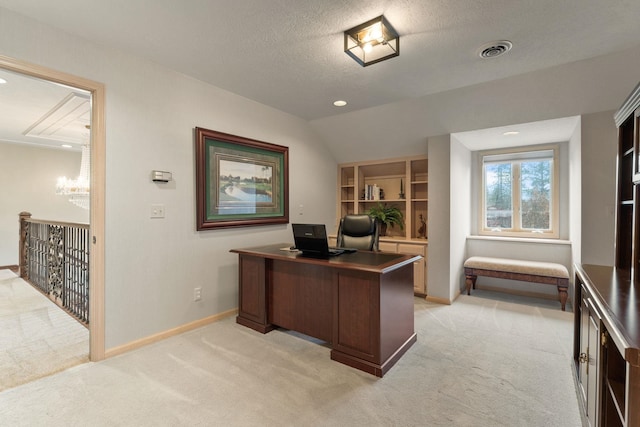 carpeted home office featuring lofted ceiling and a textured ceiling