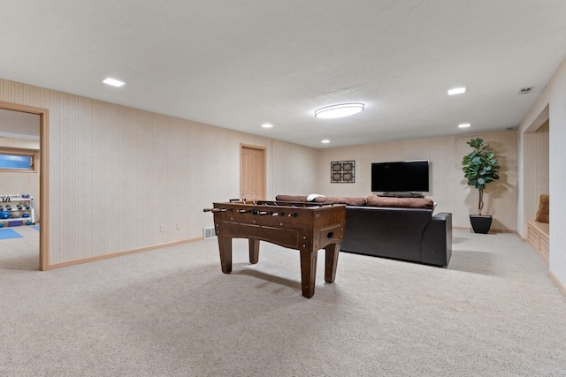 game room featuring light carpet