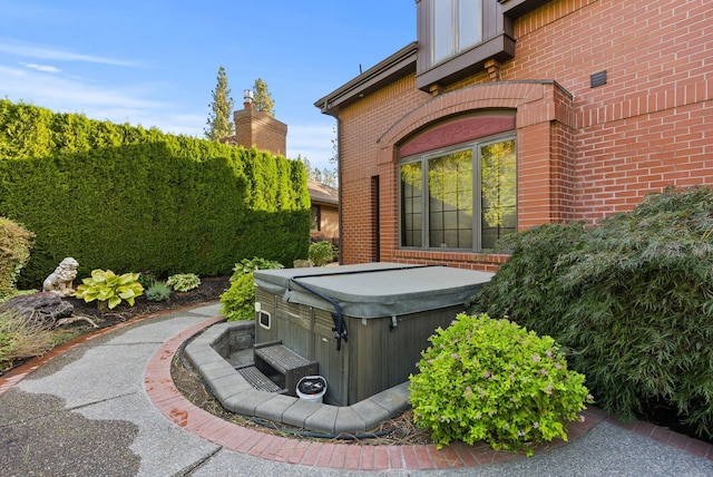 view of patio with a hot tub