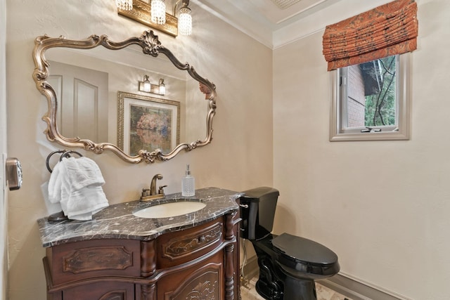 bathroom featuring crown molding and vanity