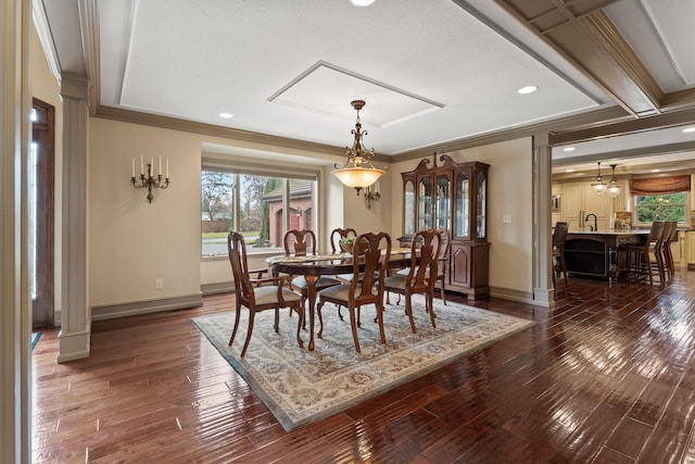 dining room with ornamental molding and dark hardwood / wood-style floors