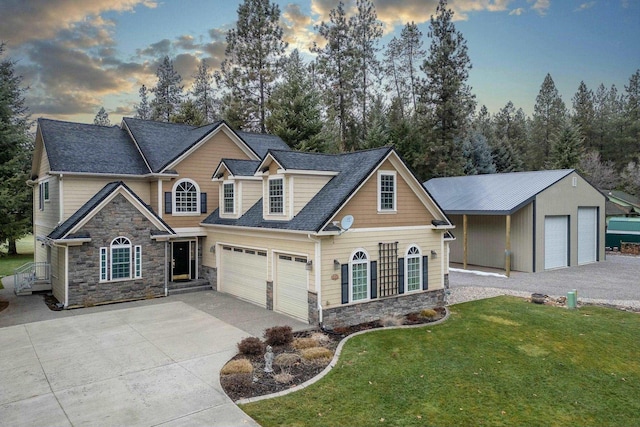 view of front of property featuring a yard and a garage