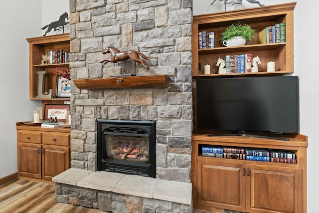living room with a fireplace and light hardwood / wood-style floors