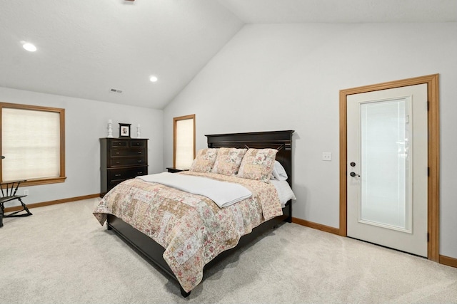 carpeted bedroom featuring lofted ceiling
