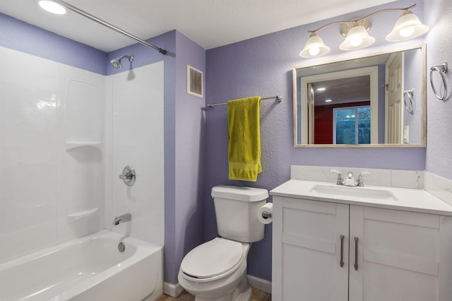 full bathroom with shower / tub combination, vanity, and toilet