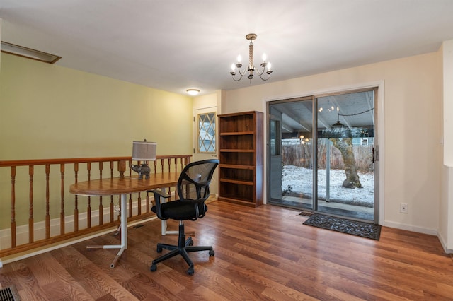 office area featuring dark hardwood / wood-style flooring and a notable chandelier