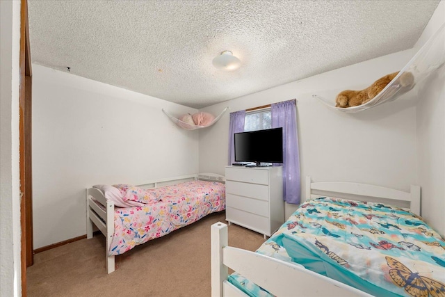 carpeted bedroom with a textured ceiling