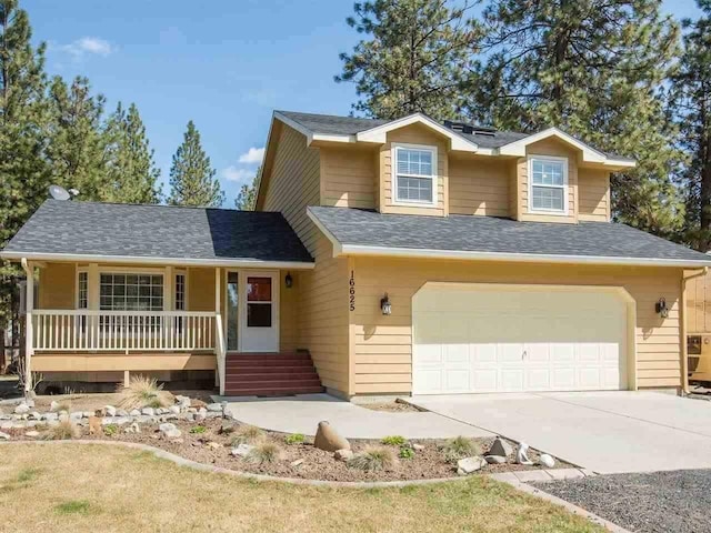 view of front of property with a porch, a garage, solar panels, a shingled roof, and driveway