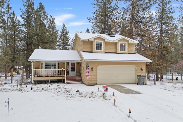 view of front of home with a porch and a garage