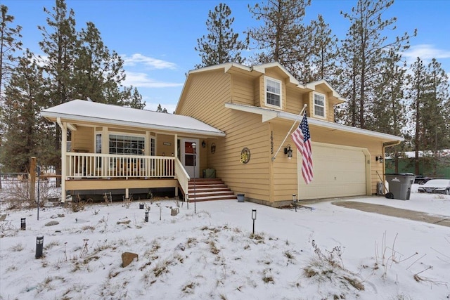 view of front of house with covered porch and an attached garage