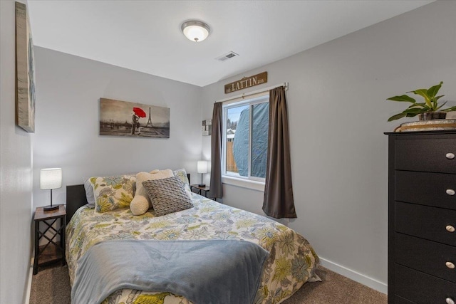 bedroom featuring dark colored carpet