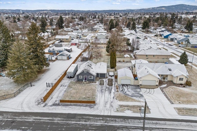 snowy aerial view featuring a mountain view