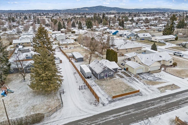 snowy aerial view with a mountain view