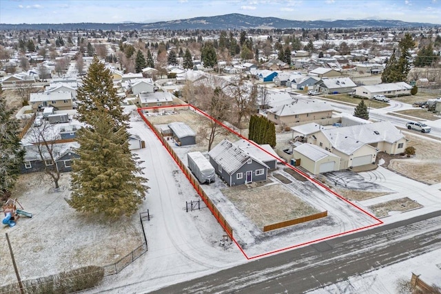 birds eye view of property with a mountain view