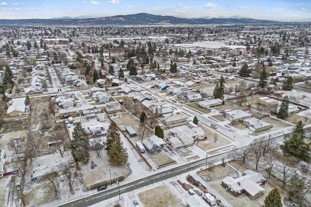 snowy aerial view with a mountain view