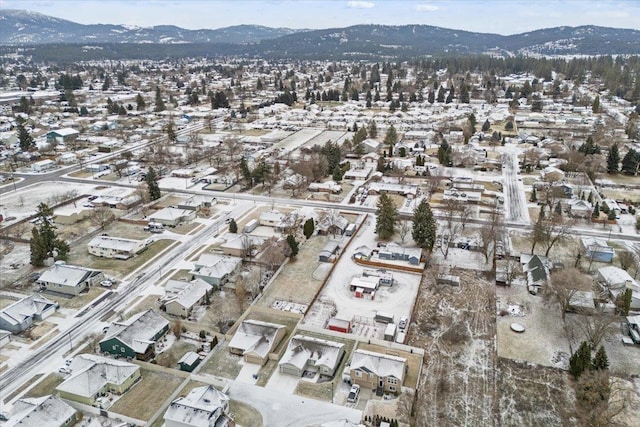 snowy aerial view with a mountain view