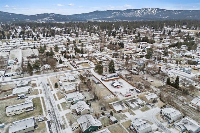 snowy aerial view with a mountain view