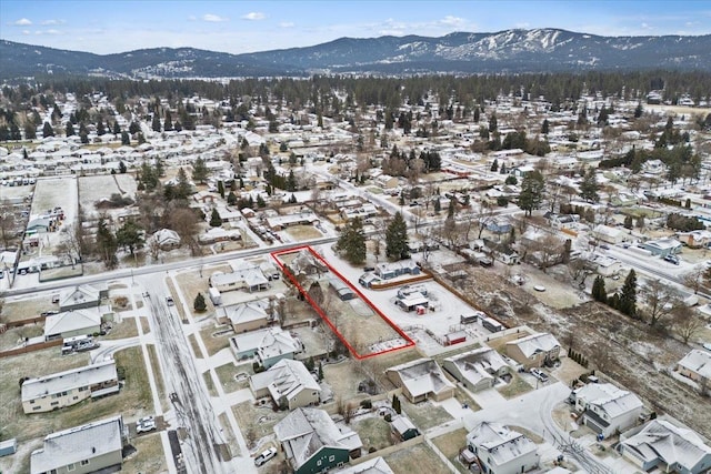 snowy aerial view featuring a mountain view