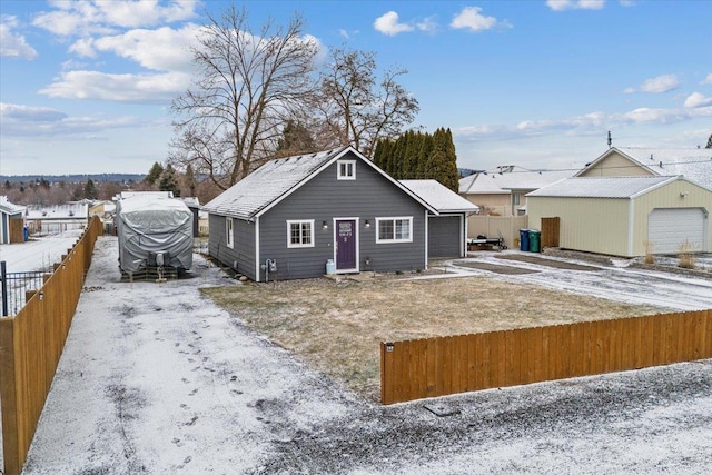 snow covered property featuring a garage