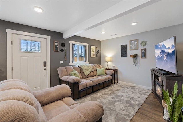 living room with beamed ceiling and hardwood / wood-style floors