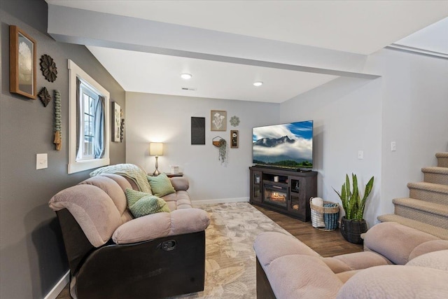 living room featuring a fireplace